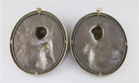 A pair of 19th century French bronze oval relief plaques of Bacchanalian women, overall W.6.75in. H.8.25in.
